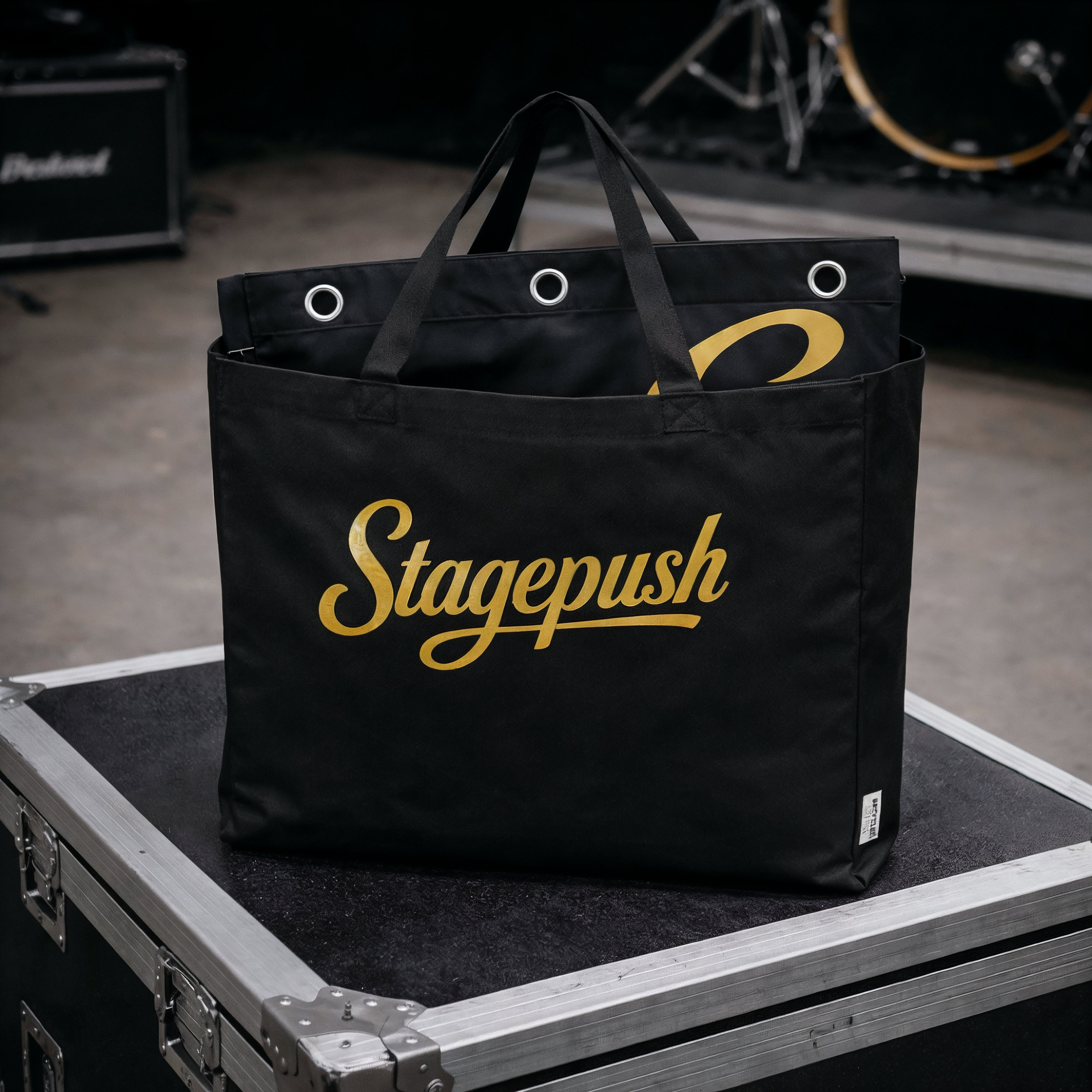 Printed stage backdrop hanging behind band during live show