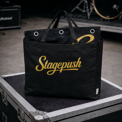 Printed stage backdrop hanging behind band during live show